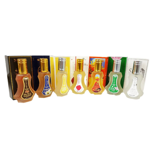 Set of small bottles with various labels on a white background