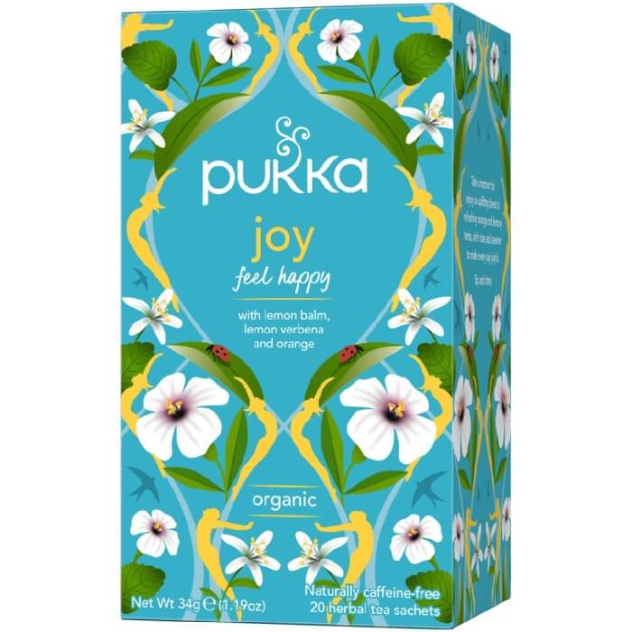 Box of Pukka Joy organic herbal tea with a floral and colorful design, featuring lemon balm, sweet fennel seeds, and orange peel.