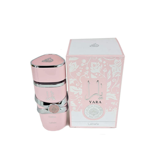 A pink bottle of Lattafa Yara women's perfume with a capacity of 100ml, accompanied by its packaging box which has floral designs and the brand's logo.