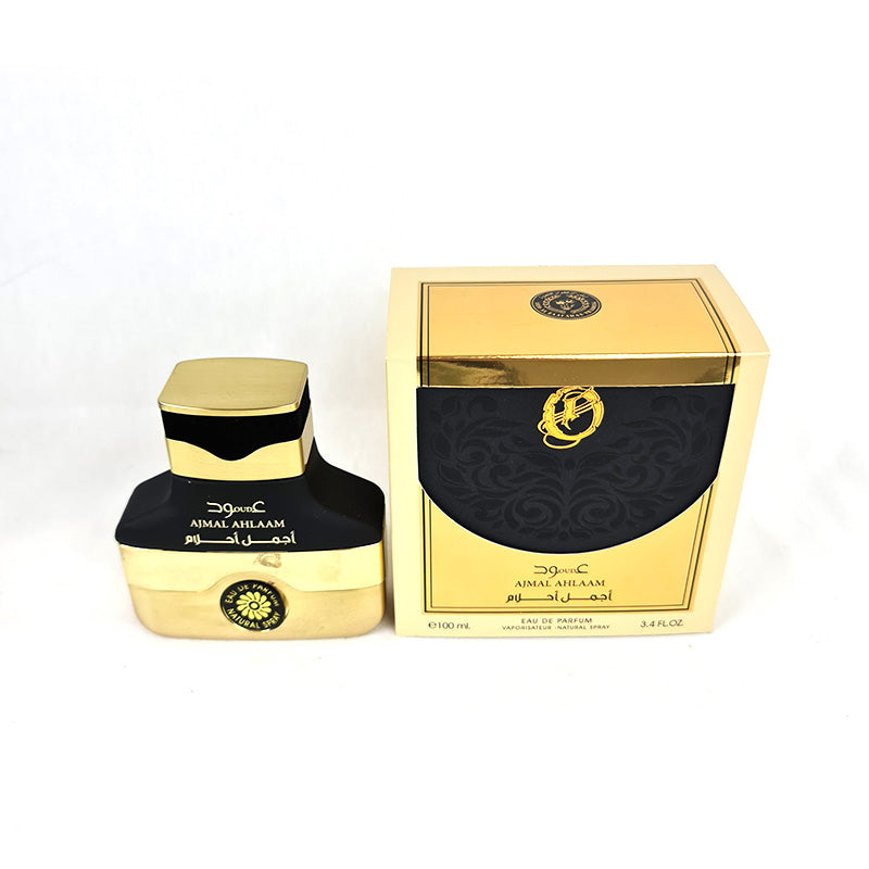 A gold-colored bottle of Ard AL Zaafaran Perfume Ajmal Ahlaam Oud EDP 100ml alongside its packaging box.