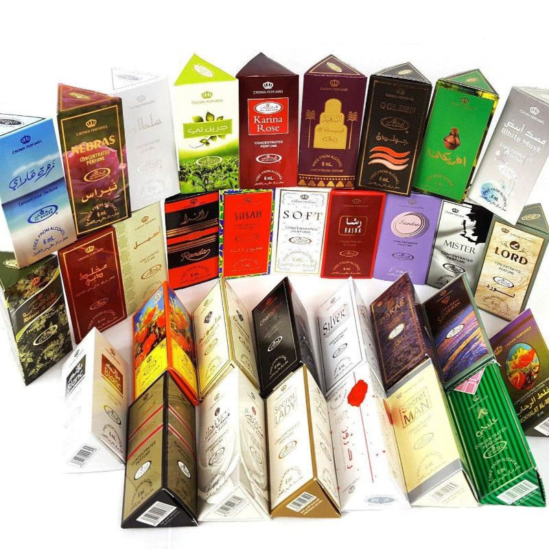 Assortment of 33 different Al-Rehab brand perfume oil bottles in various colors and designs, showcasing a variety of fragrances.
