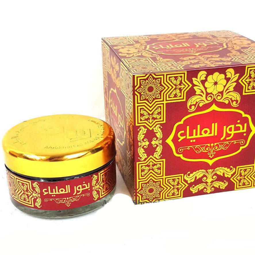 A product image featuring a red and gold box with decorative patterns alongside a jar of Mabkharat AL-Khaleij incense.