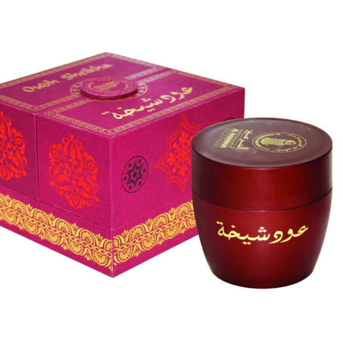 A pink and gold boxed incense with a matching red lid, labeled 'Oudh Sheikha' by Al Haramain Perfumes.