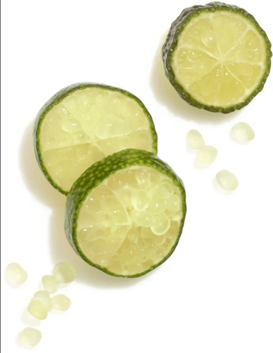 Fresh lime slices with seeds on a white background