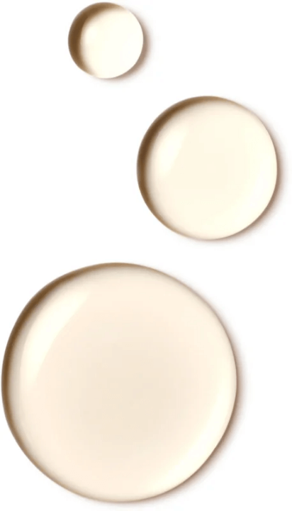 Close-up of translucent hair oil drops from Wella Invigo Color Brilliance highlighting product texture and sheen.