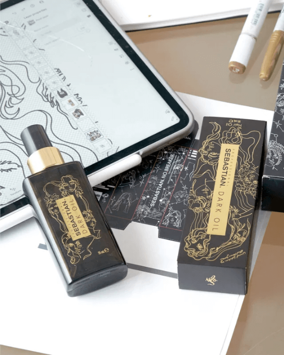 Sebastian Professional Dark Oil bottle with packaging, enhancing hair shine and nourishment, beside a tablet on a desk.