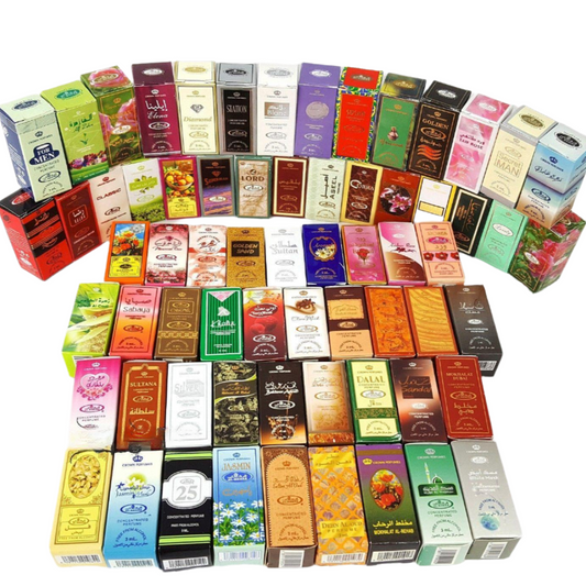 Collection of Al Rehab Crown Perfume boxes in various colors and designs on a white background.